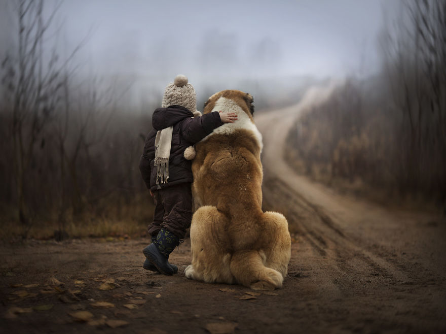 kid with dog on road